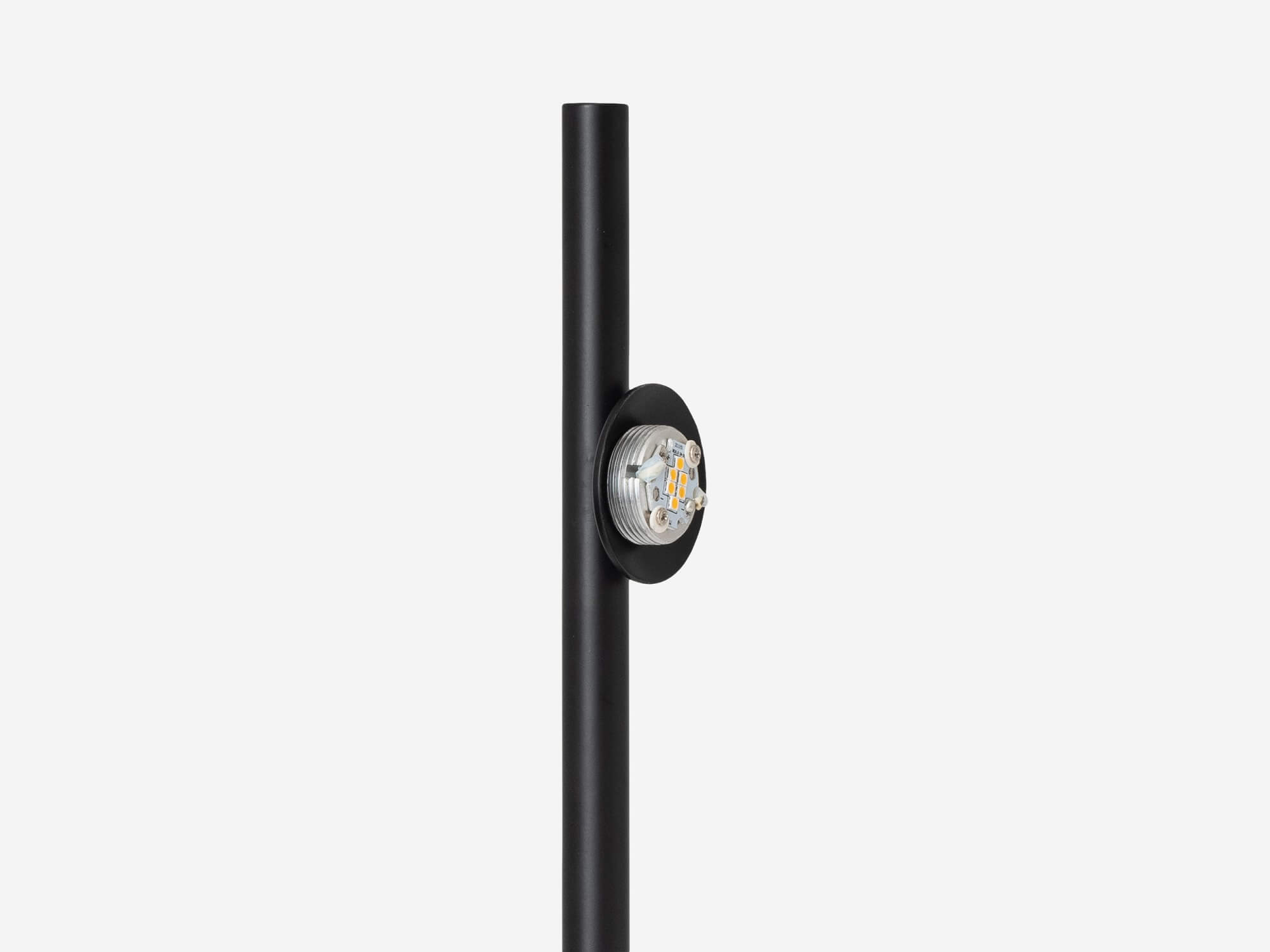 detail view of the eq3 black stem table lamp without cover